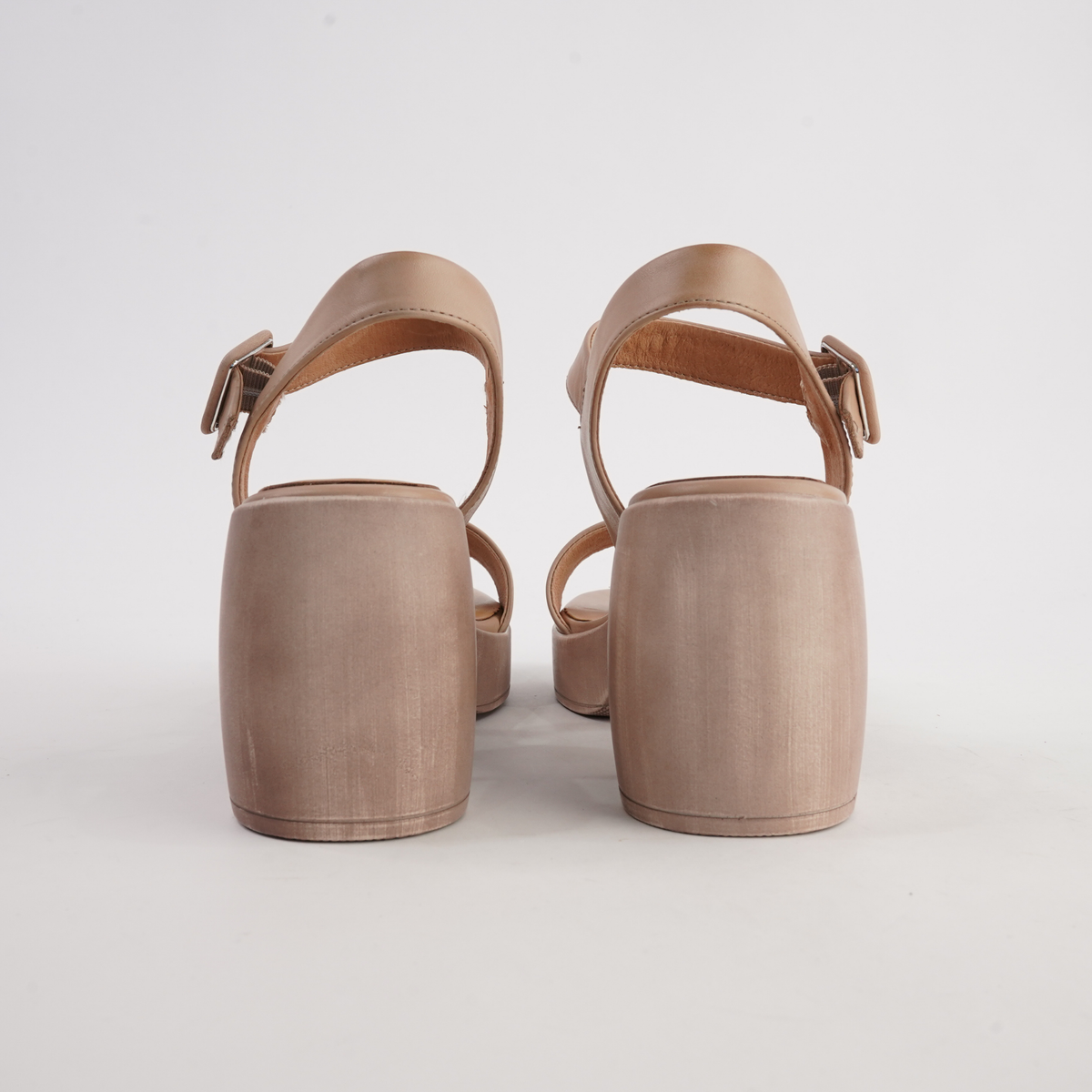 Spice tan leather heels by EOS Footwear, showcasing a stylish design with a sleek silhouette and elegant heel.